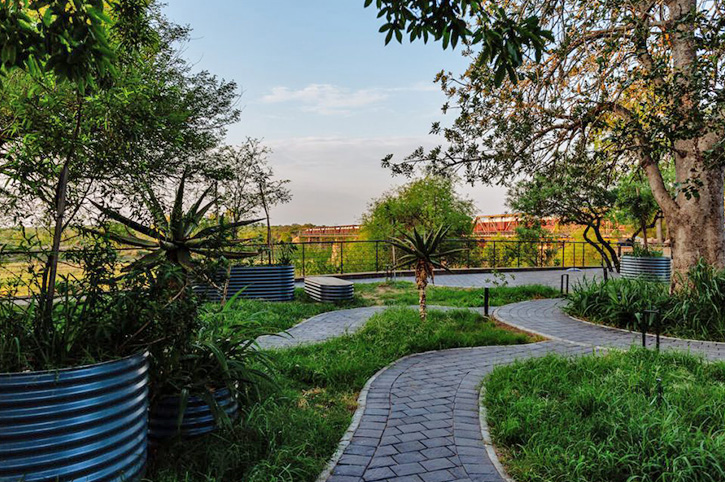Gardens and train, Bridge House Suites, Kruger Shalanti, Kruger National Park, South Africa