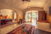 Chobe Game Lodge Triple Room Bedroom and Lounge