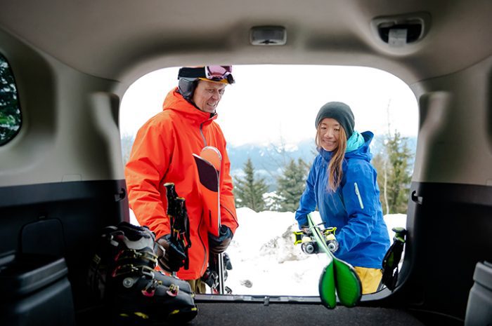 Couple getting ready to go skiing