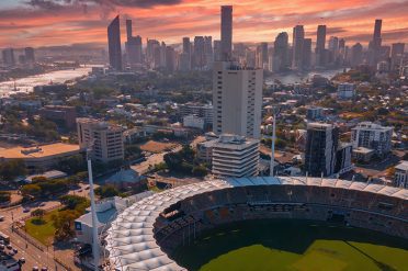 The Gabba cricket ground & Brisbane skyline at sunset, Queensland, Australia