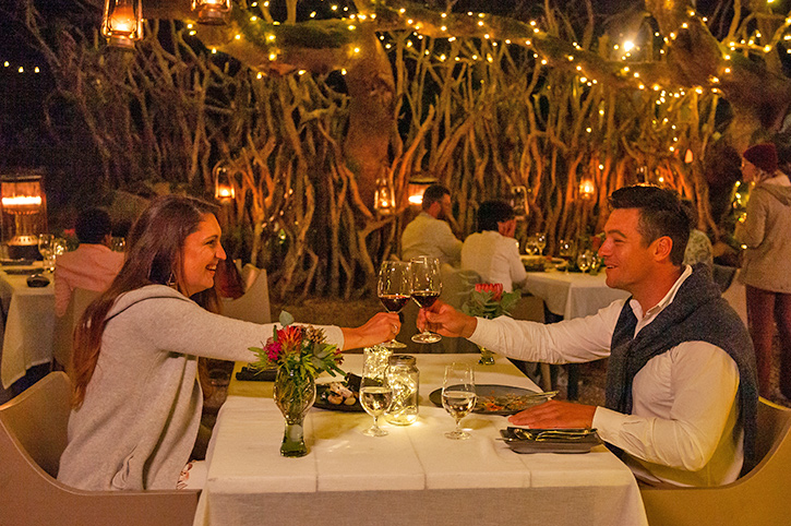 Couple dining outdoors, Grootbos Nature Reserve, Western Cape, South Africa