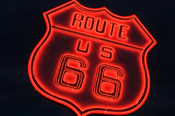 Red Neon Route 66 Sign at night