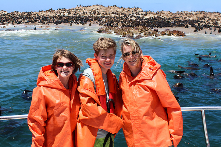 Family in front of seal colony, Marine Safari, Grootbos Nature Reserve, Western Cape, South Africa