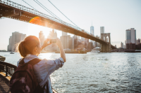 Taking a Picture of the Brooklyn Bridge and Manhattan Skyline, New York City